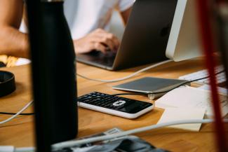person using silver MacBook by charlesdeluvio courtesy of Unsplash.